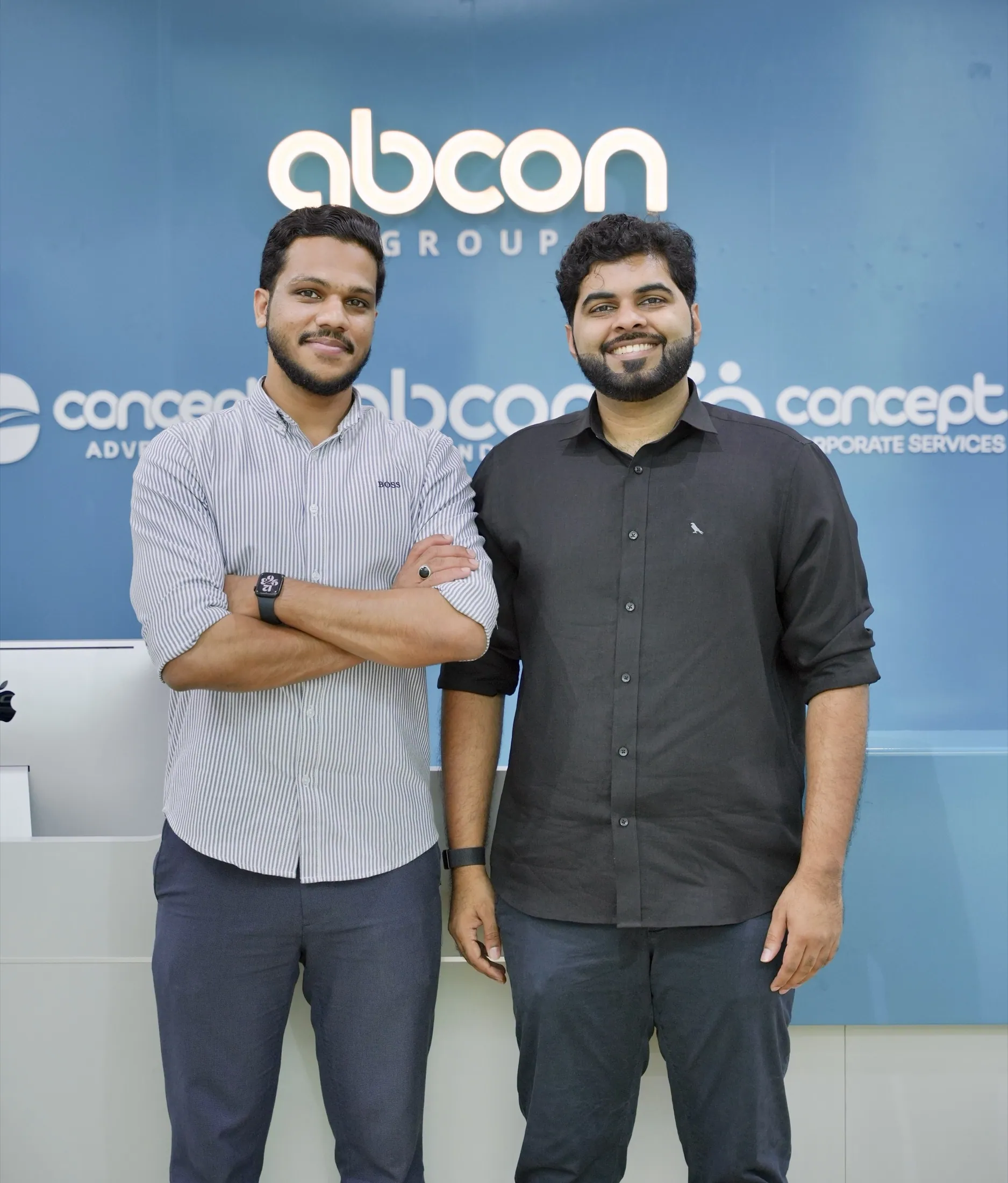 Muhammed Shafad in discussion in front of the Abcon Branding wall