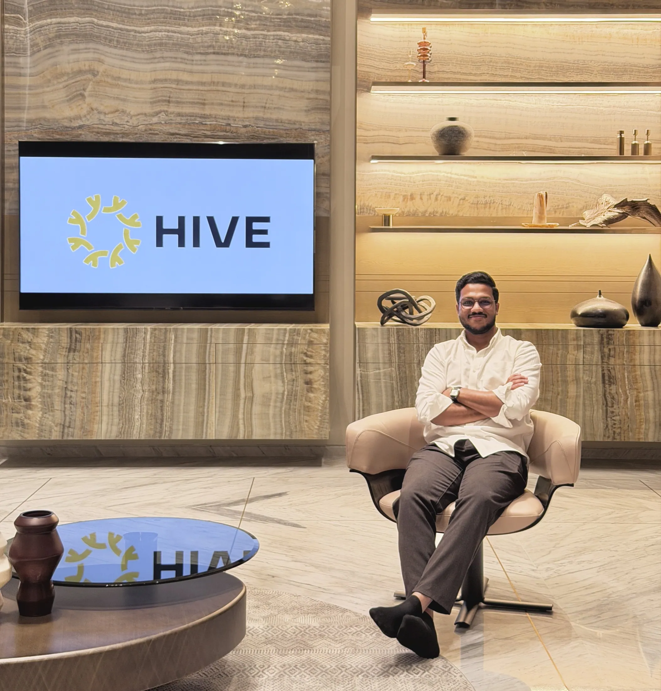 Muhammed Shafad seated at HIVE in front of the HIVE screen