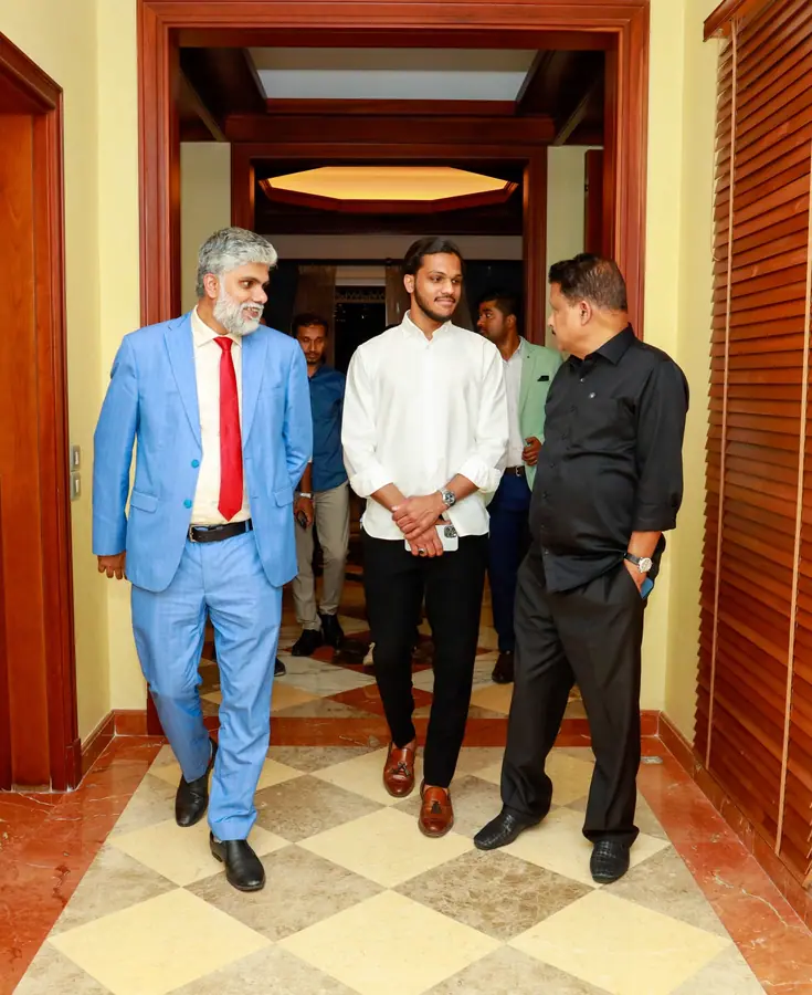 Muhammed Shafad walking alongside his mentors