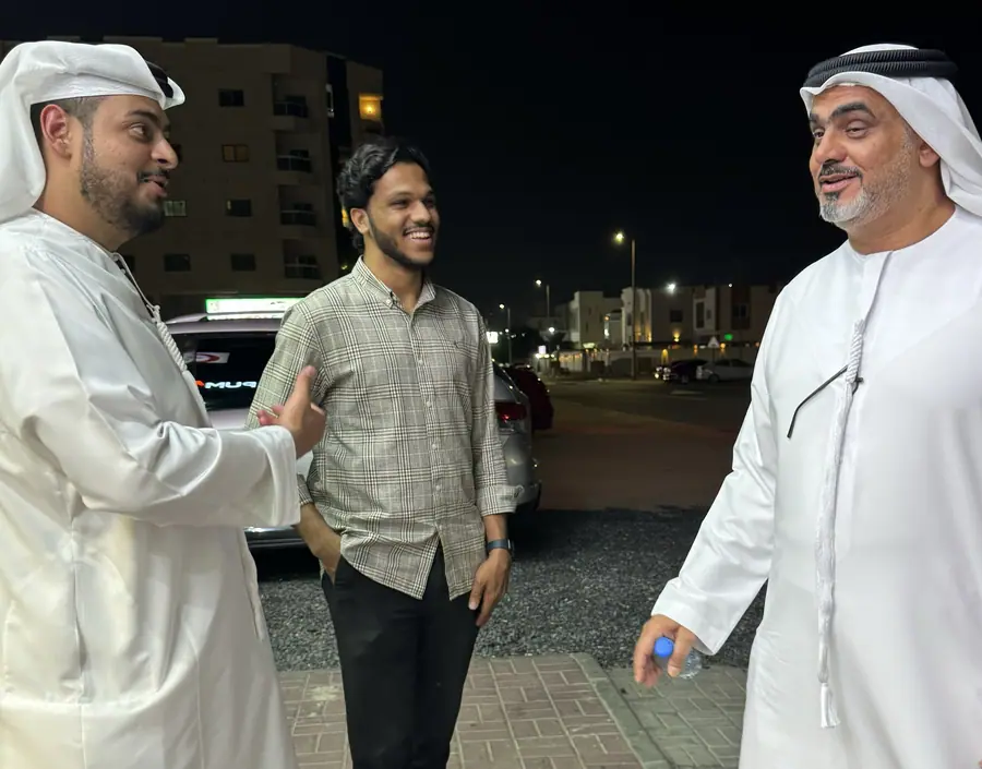 An evening conversation outdoors with Emirati men