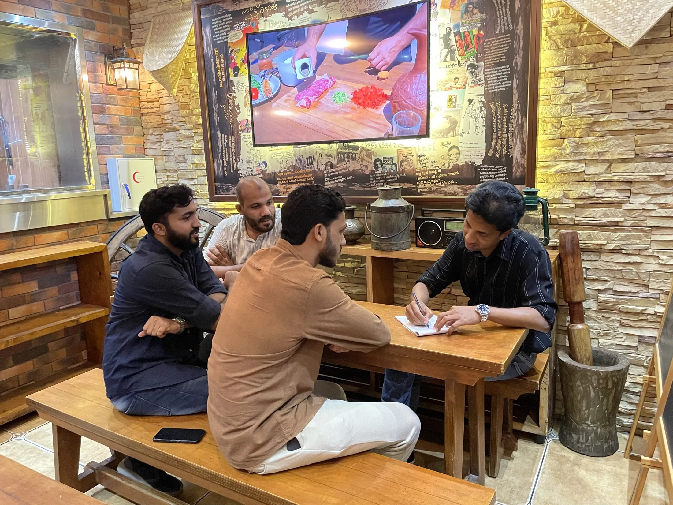 A conversation around a cafe table